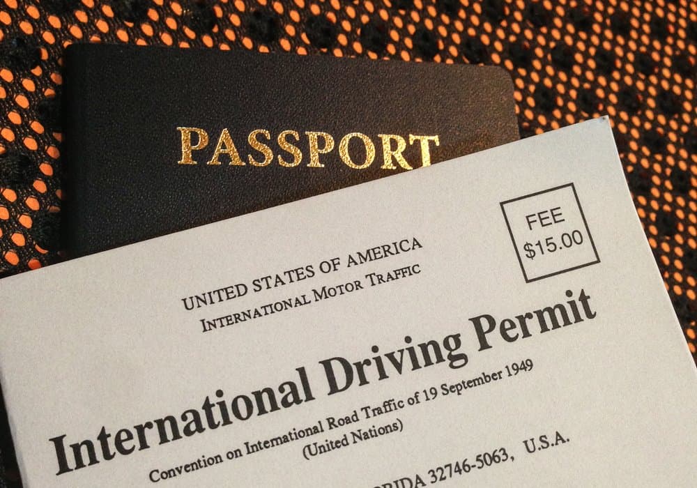 A US passport and an International Driving Permit booklet, the two documents needed to ride legally in Thailand